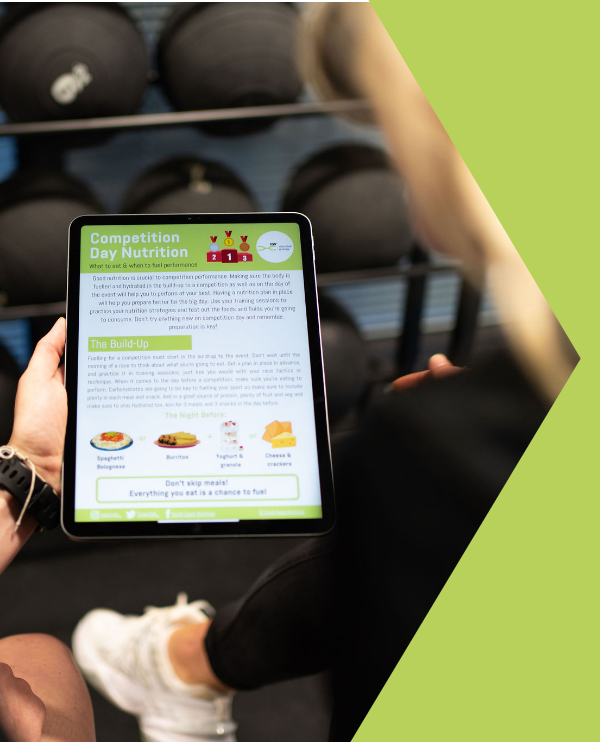 person using meal planning app on phone in kitchen - YSN Kitchen App – Youth Sport Nutrition