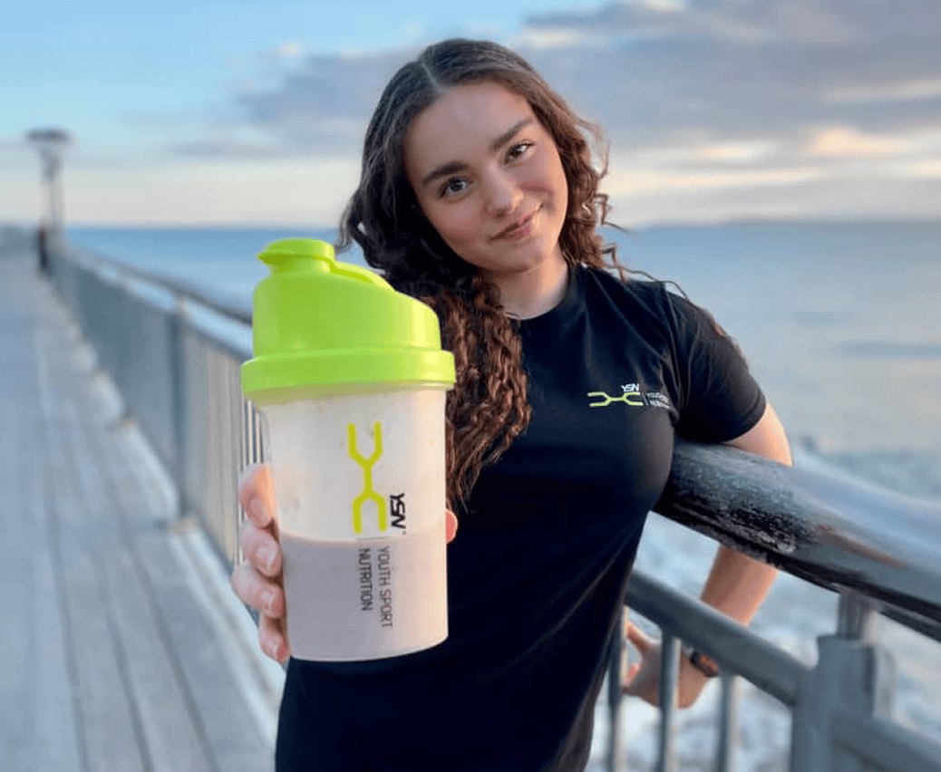 Teen athlete holding a NUTRI-TEEN shaker